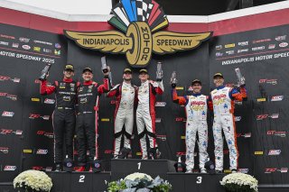 #4 Aston Martin Vantage AMR GT4 EVO of Braydon Arthur / Mike David Ortmann, JMF Motorsports, GT4 America, Silver, SRO America, Indianapolis Motor Speedway, Indianapolis, IN, Oct 16–19, 2025 #97 BMW M4 GT4 (G82) EVO of Kenton Koch / Kevin Boehm, Random Van | Fred Hardy | www.FredHardyPhoto.com ©2025